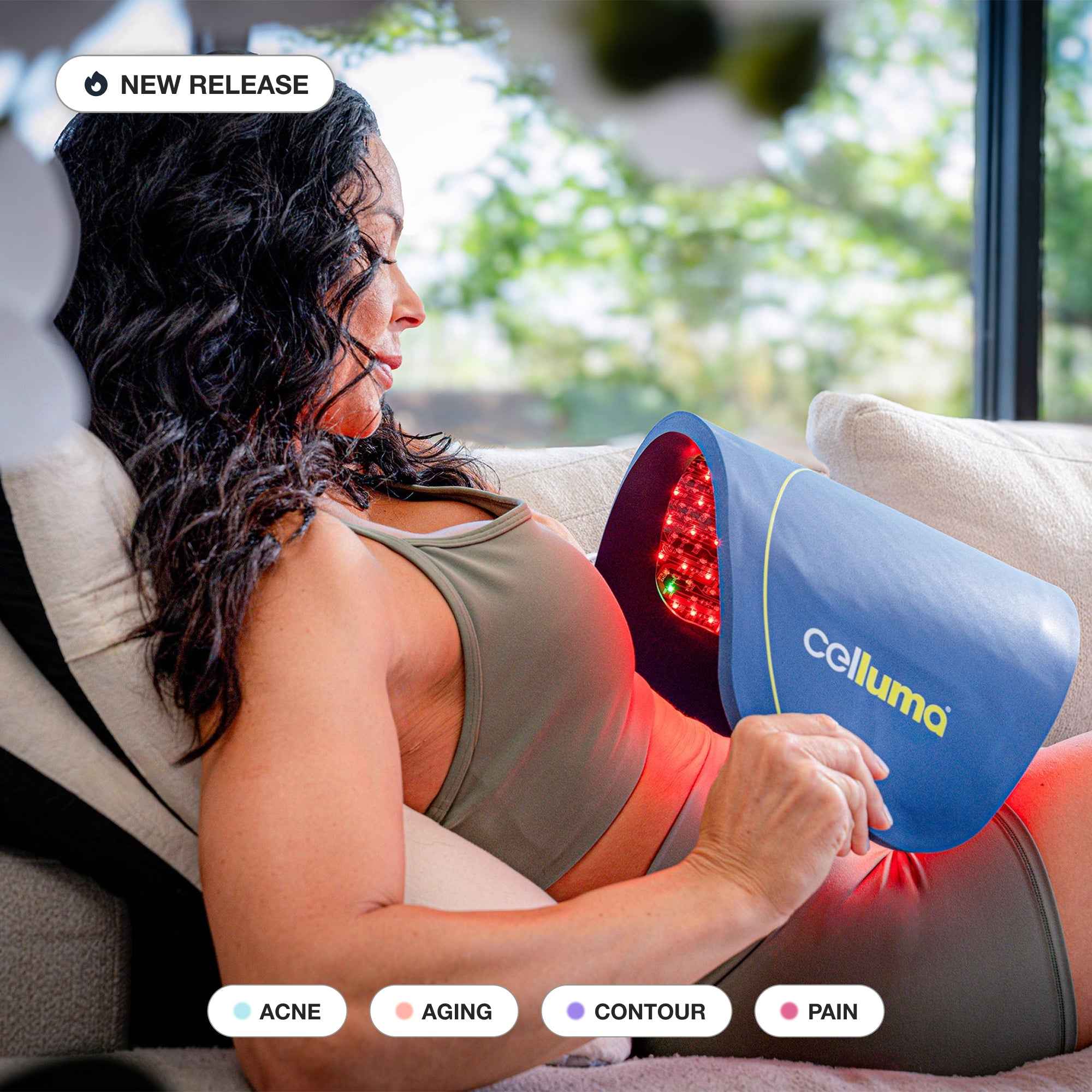 Woman using Celluma PRO Plus LED red light therapy with 4 modes for acne, wrinkles, pain, and body contouring.