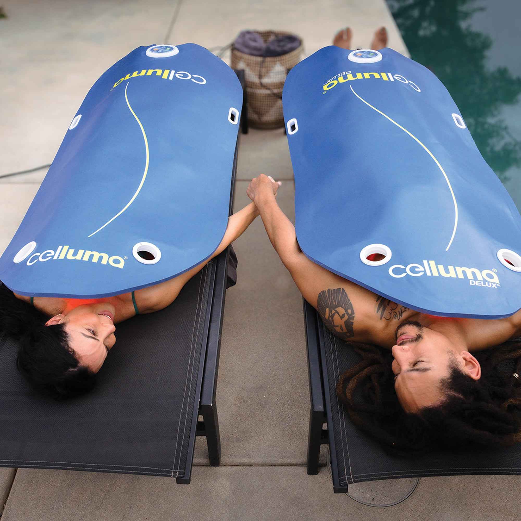 Man and woman using Celluma DELUX II full-body LED light therapy for rejuvenation, pain relief, and recovery.